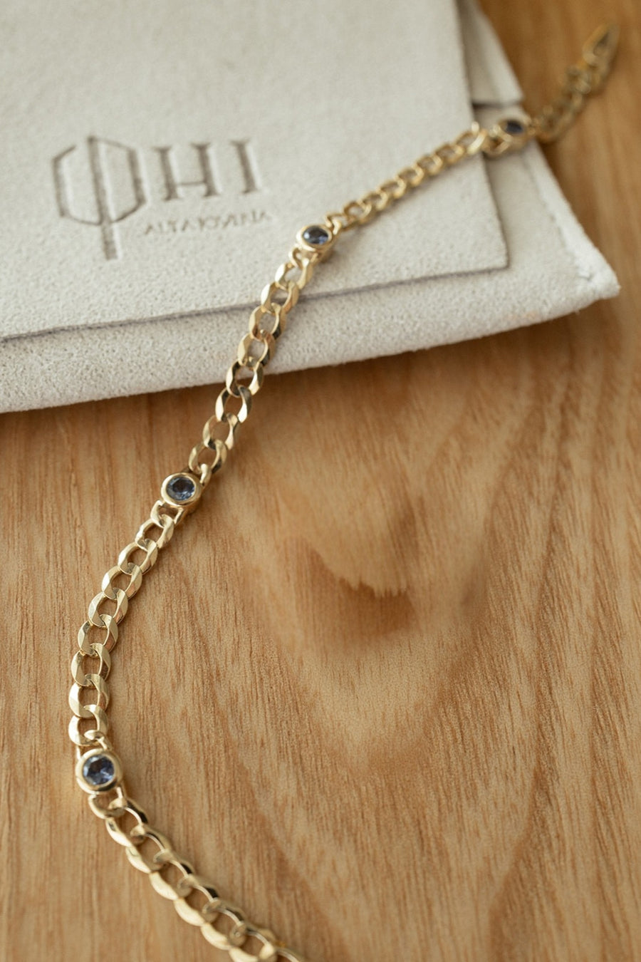Pulsera cuban con zafiros azules 14k