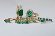 Anillo Kate esmeralda OV 1.6ct con halo de diamantes 14k