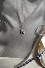 Dije zafiro azul PS 0.5ct con halo de diamantes 14k