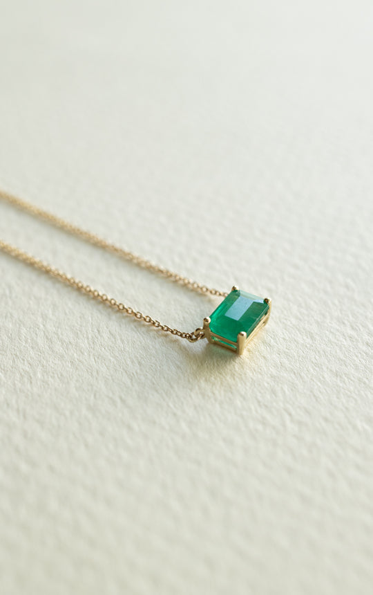 Dije esmeralda EC 0.75ct 4 uñas con cadena 14k