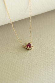 Dije rubí RD 0.46ct c/halo en diam 14k