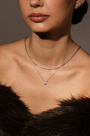 Dije tourmalina Paraiba 0.45ct con halo de diamantes 0.1ct 14k