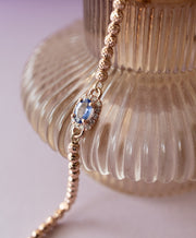 Pulsera Ikaria zafiro con halo de diamantes 14k