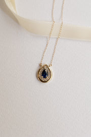 Dije Bisel PS zafiro azul .5ct c/halo de diamantes .12ct bisel 14k