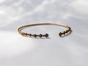 Brazalete flores diamantes negros